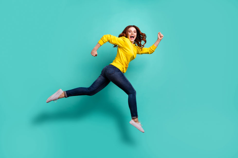 Full length body size photo of running jumping casual cute nice youngster aspiring for discounted shopping mall in jeans denim isolated turquoise color vivid background